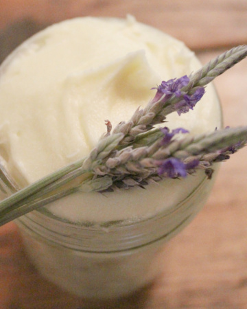 Easy diy whipped tallow balm with fresh lavender sitting on top.